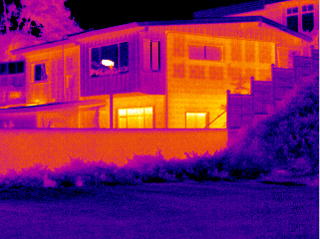 A house with an infrared camera showing the outside.